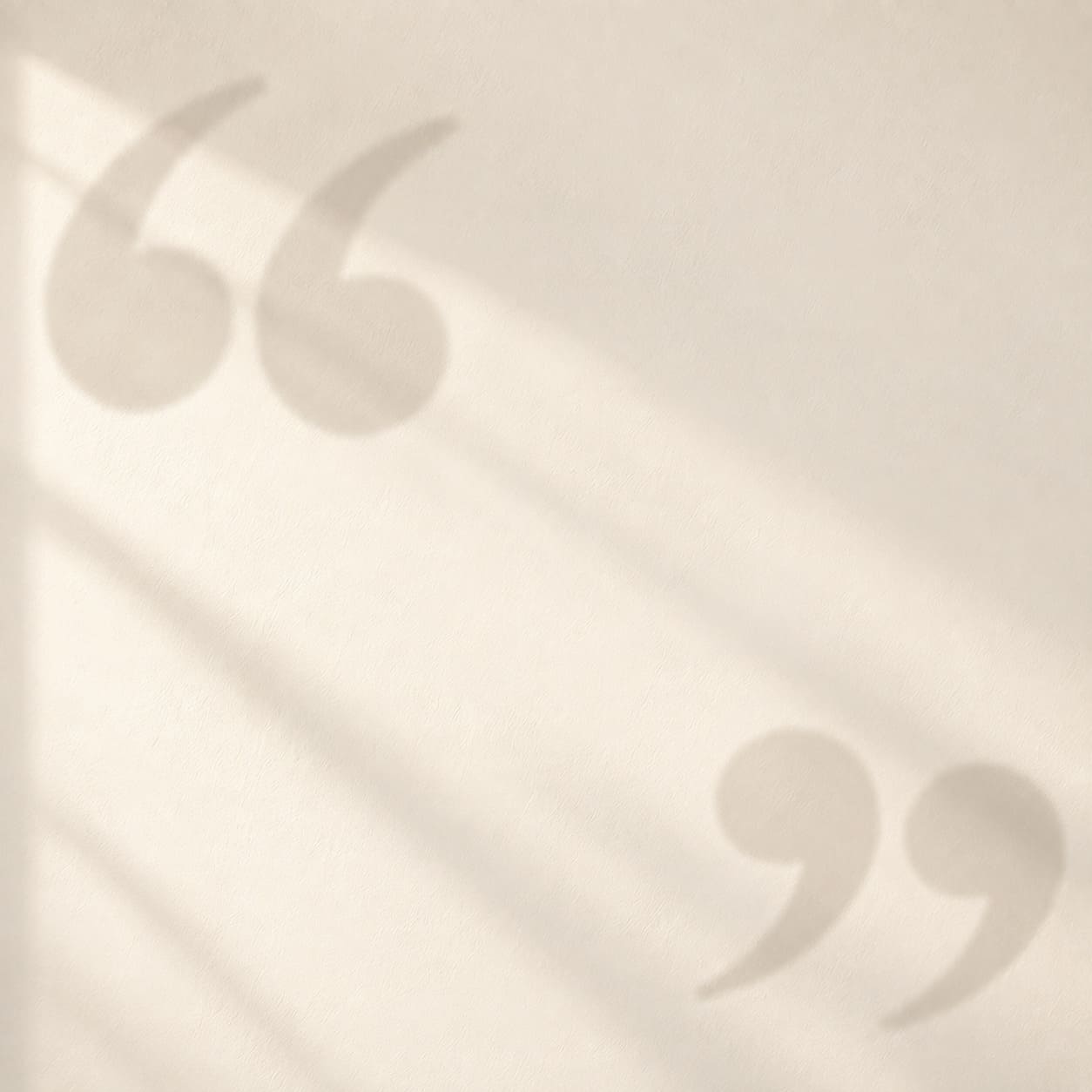 Quote-shaped shadows on a wall